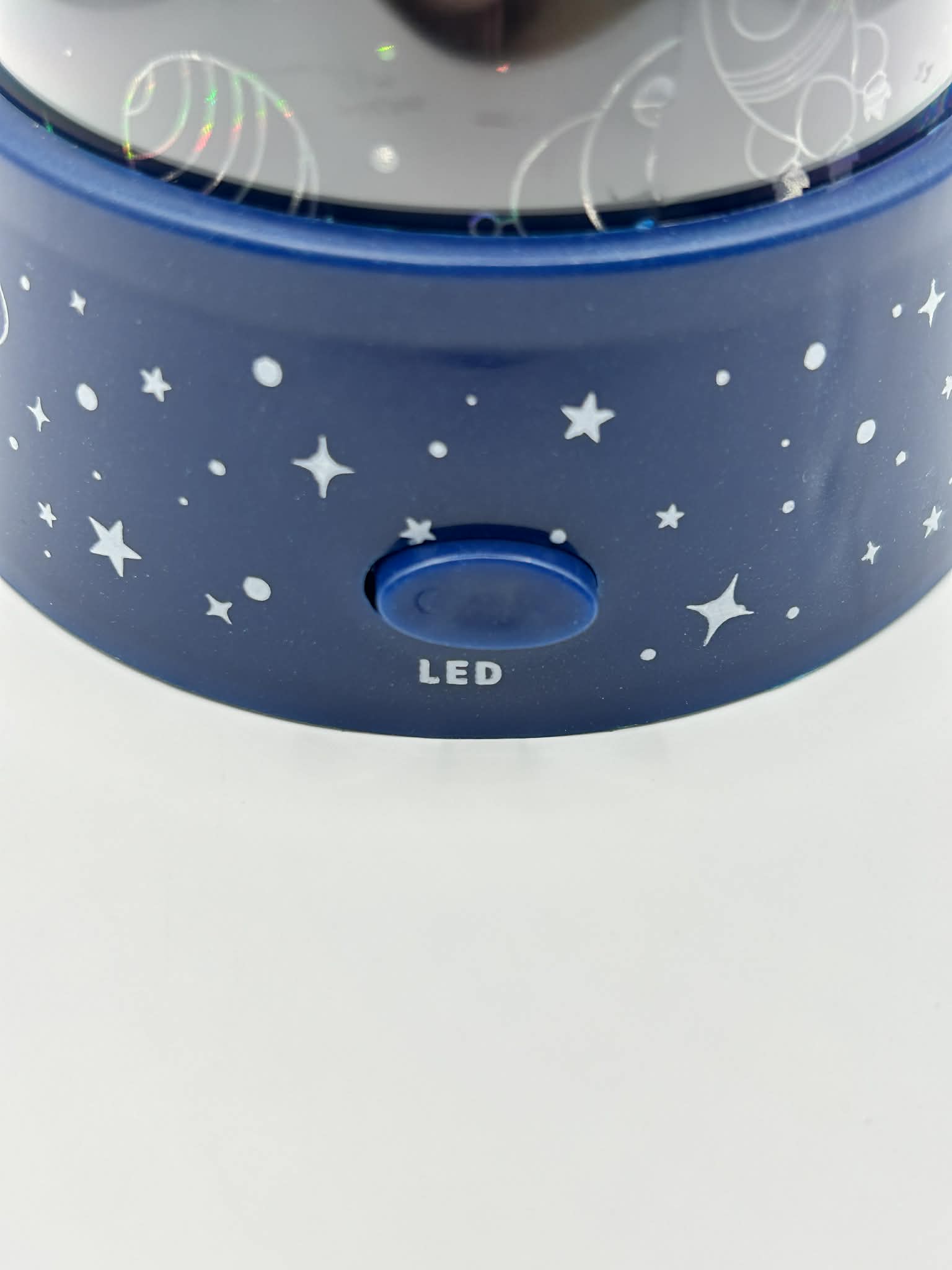 Close up on the LED switch to turn on the LED lighting effect projecting space images for those neurodivergent people needing to feel calm 