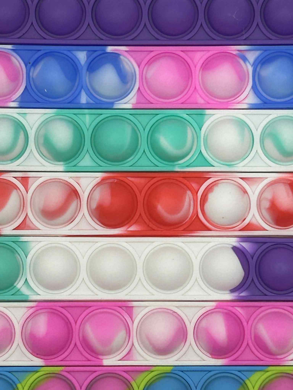 Close up on the Sensory Pop Bracelet – colourful tactile fidget accessory for neurodivergent children | The Divergent Den