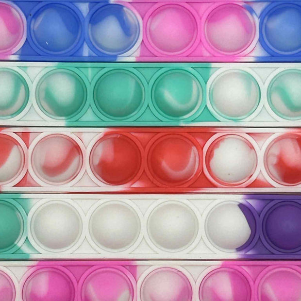 Close up on the Sensory Pop Bracelet – colourful tactile fidget accessory for neurodivergent children | The Divergent Den
