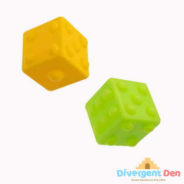 Yellow and green sensory pop cubes showing the dice design and rubber material 