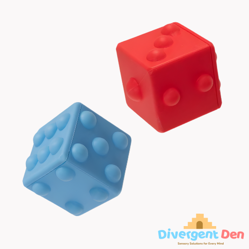 Red and blue textured sensory pop cubes on a white background with 'Divergent Den' branding.