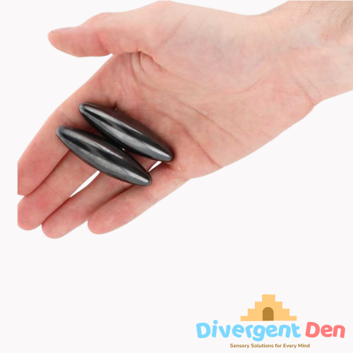 Hand holding two black fidget toys with Divergent Den logo in the corner