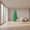 green sensory swing pod  in a living room. Sensory Swing Pod calms and regulates | The Divergent Den