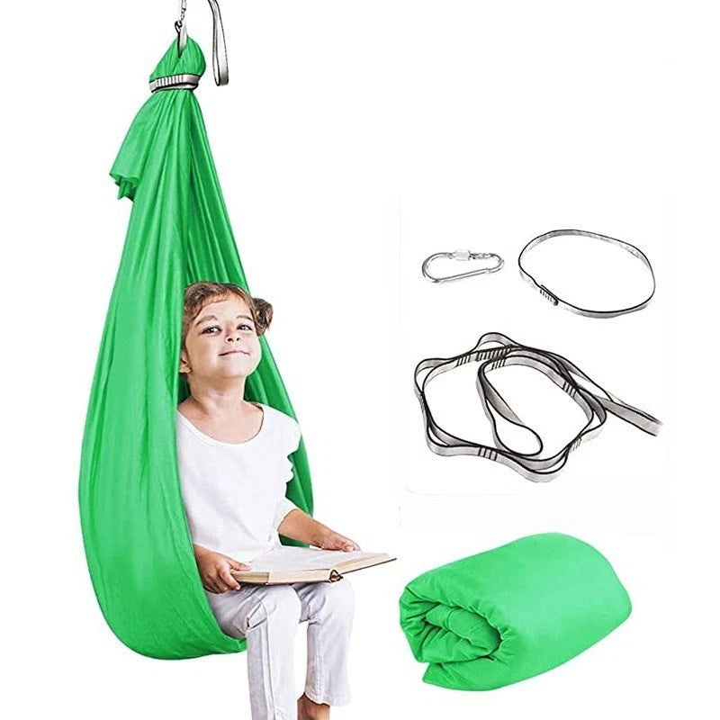 Green sensory swing image including the fixtures. Sensory Swing calms and regulates | The Divergent Den