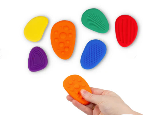 Close-up of Sensory Worry Stone showing smooth polished surface and thumb groove for tactile stimulation
