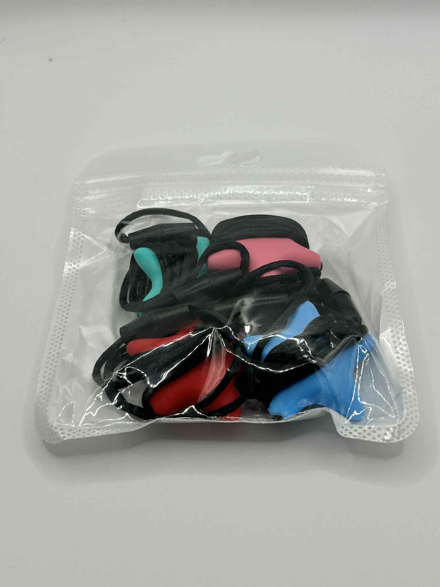 Oral Chew Star Necklace showing breakaway safety cord and BPA-free construction
