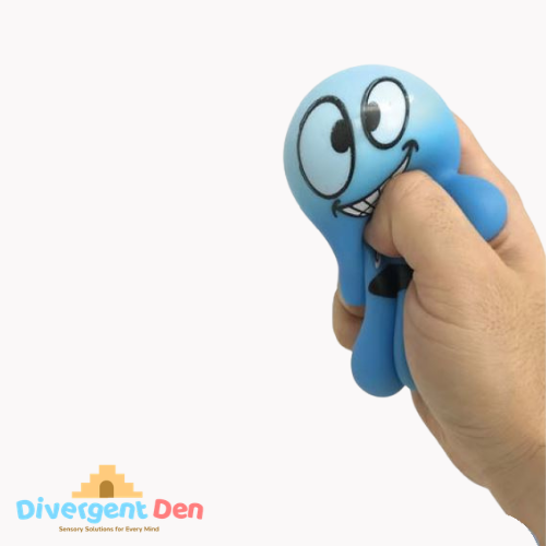 Hand holding a blue stress ball with cartoon face on a white background, featuring the Divergent Den logo.