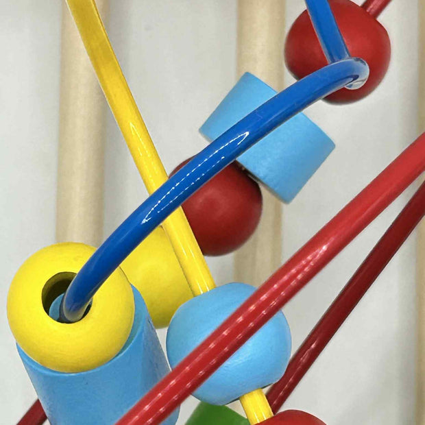 Close-up of Wooden Bead Maze showing colourful wooden beads on wire tracks for tactile play