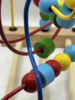 Close-up of Wooden Bead Maze showing the tracks the beads run alongside showing colourful wooden beads on wire tracks for tactile play