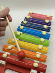 Close-up of Wooden Xylophone showing colourful wooden keys and mallets for tactile and auditory play