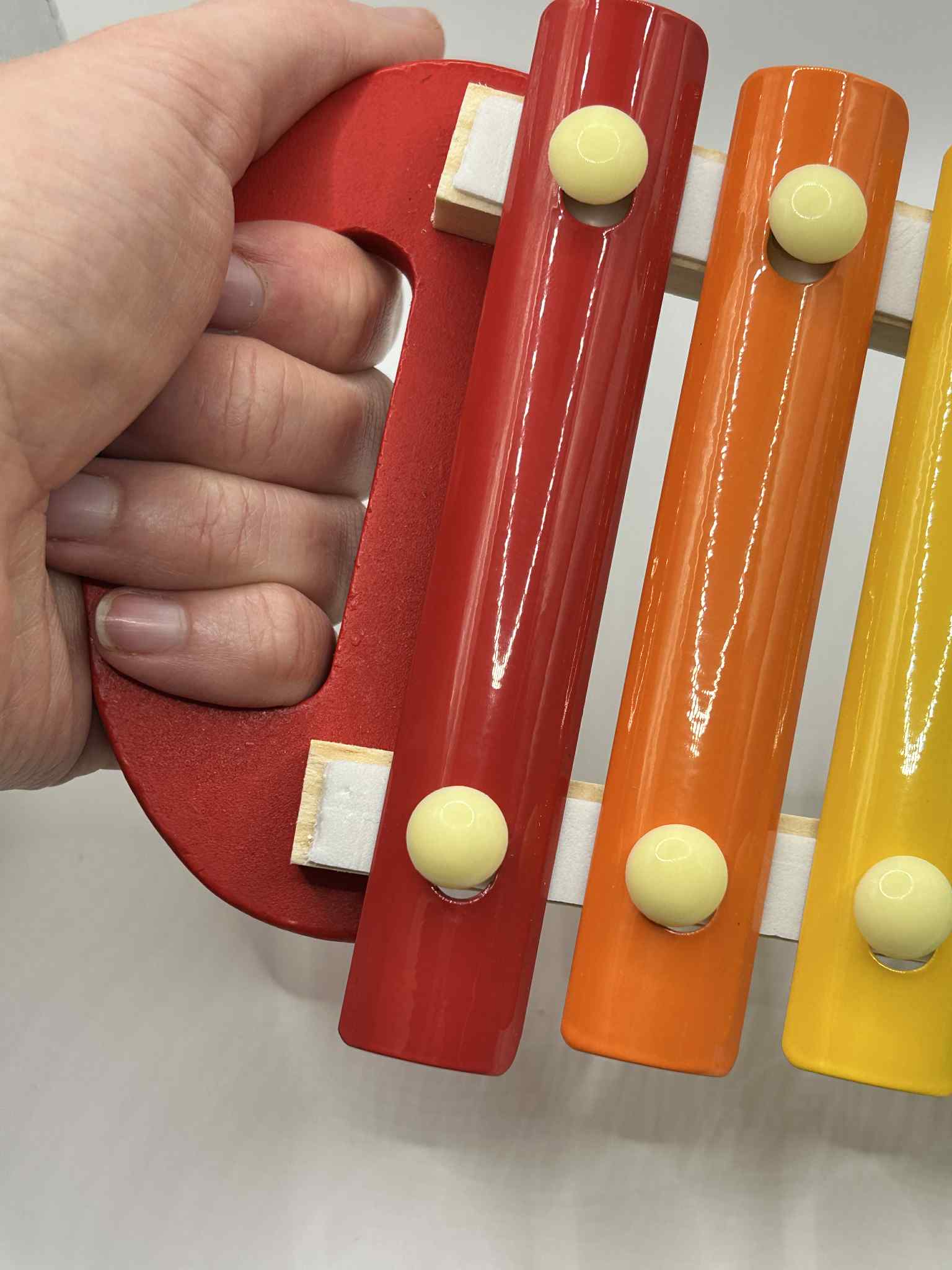 Close-up of Wooden Xylophone showing colourful wooden keys for tactile and auditory play