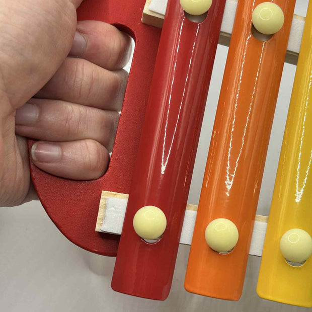 Close-up of Wooden Xylophone showing colourful wooden keys for tactile and auditory play