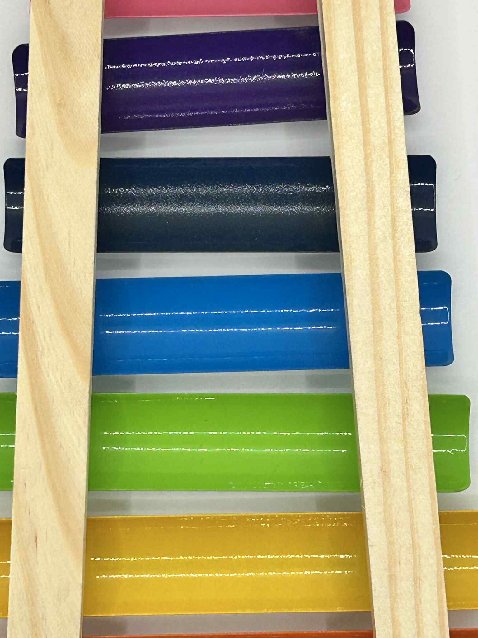 Wooden Xylophone – close up of the keys for the educational musical toy for toddlers to develop rhythm and fine motor skills | The Divergent Den