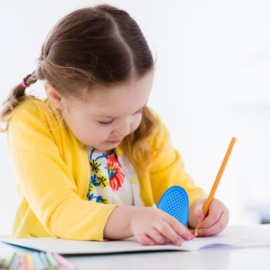 Sensory Worry Stones - child using the fidget stone - smooth calming fidget stones for anxiety relief and focus | The Divergent Den