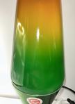  Close-up of rainbow lava lamp gradient showing green to yellow ombre glass with soothing motion