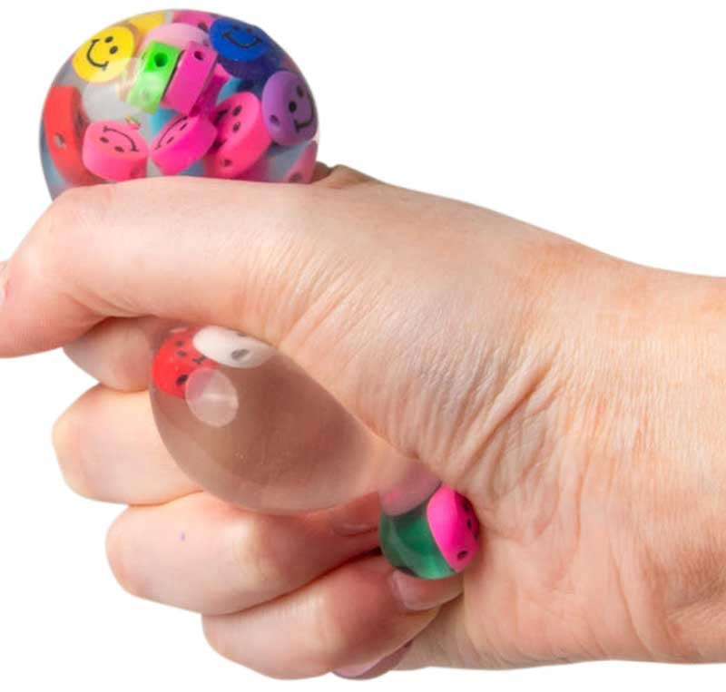 Six sensory fidget toys from Scrunchems box including sugar marble ball squish balls foam bear and colour change ball