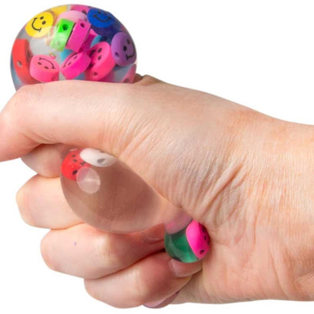 Six sensory fidget toys from Scrunchems box including sugar marble ball squish balls foam bear and colour change ball